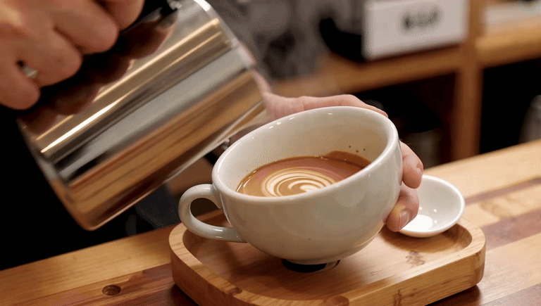 AI-generated video of latte art being poured in a café